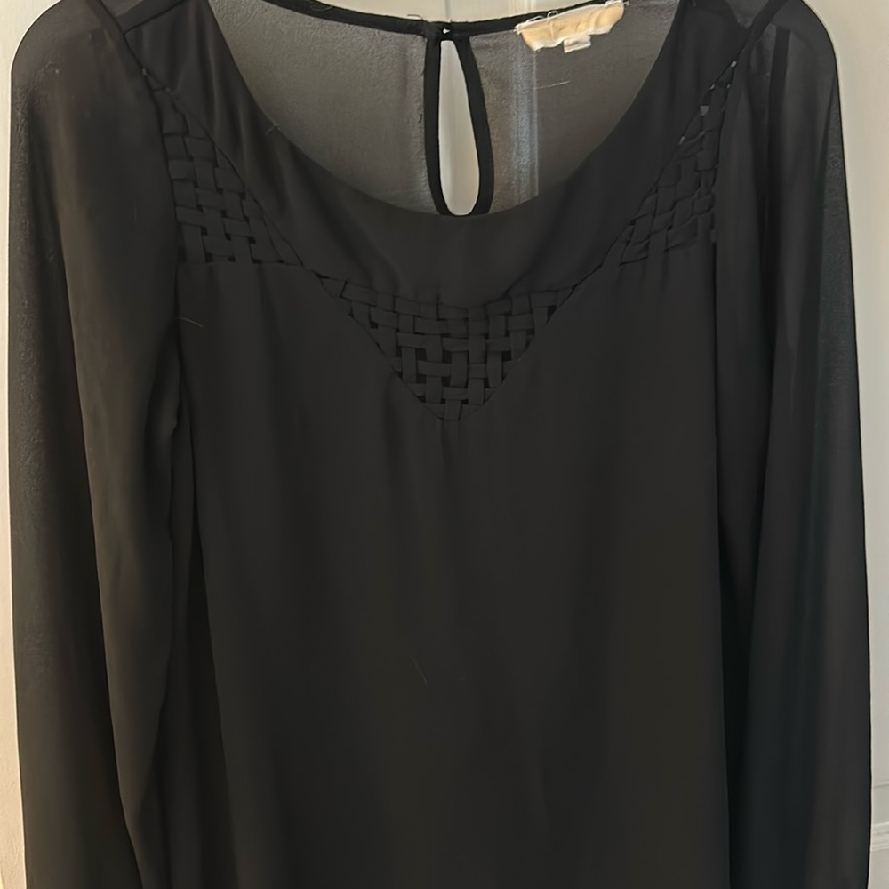 Simple black blouse.